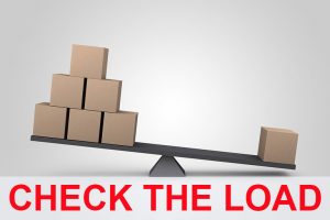 check load stability before moving heavy machinery